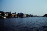 River Amstel with oldest bridge in Amsterdam (300 years old) by James Doan