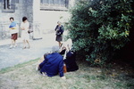 Women playing with toy camera, 1976 by James Doan