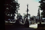 View of cross at enterence of cemetary by James Doan