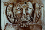 A scene from one of the outer plates of the Gondestrup cauldron, showing a diety holding a stag in either hand by James Doan