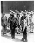 Saluting An Officer by Sailors Posing in Front of a NASFL Building
