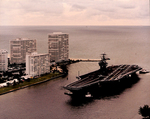 USS Theodore Roosevelt (CVN-71) Aircraft Carrier being escorted by Tug Boats into Port Everglades_FL by Courtesy of the Naval Air Station Fort Lauderdale Museum
