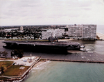 USS Theodore Roosevelt (CVN-71) guided by Tug Boats in Port Everglades_FL by Courtesy of the Naval Air Station Fort Lauderdale Museum