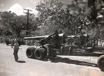 Big Gun Rolling Down the Street in Honolulu by Courtesy of the Naval Air Station Fort Lauderdale Museum